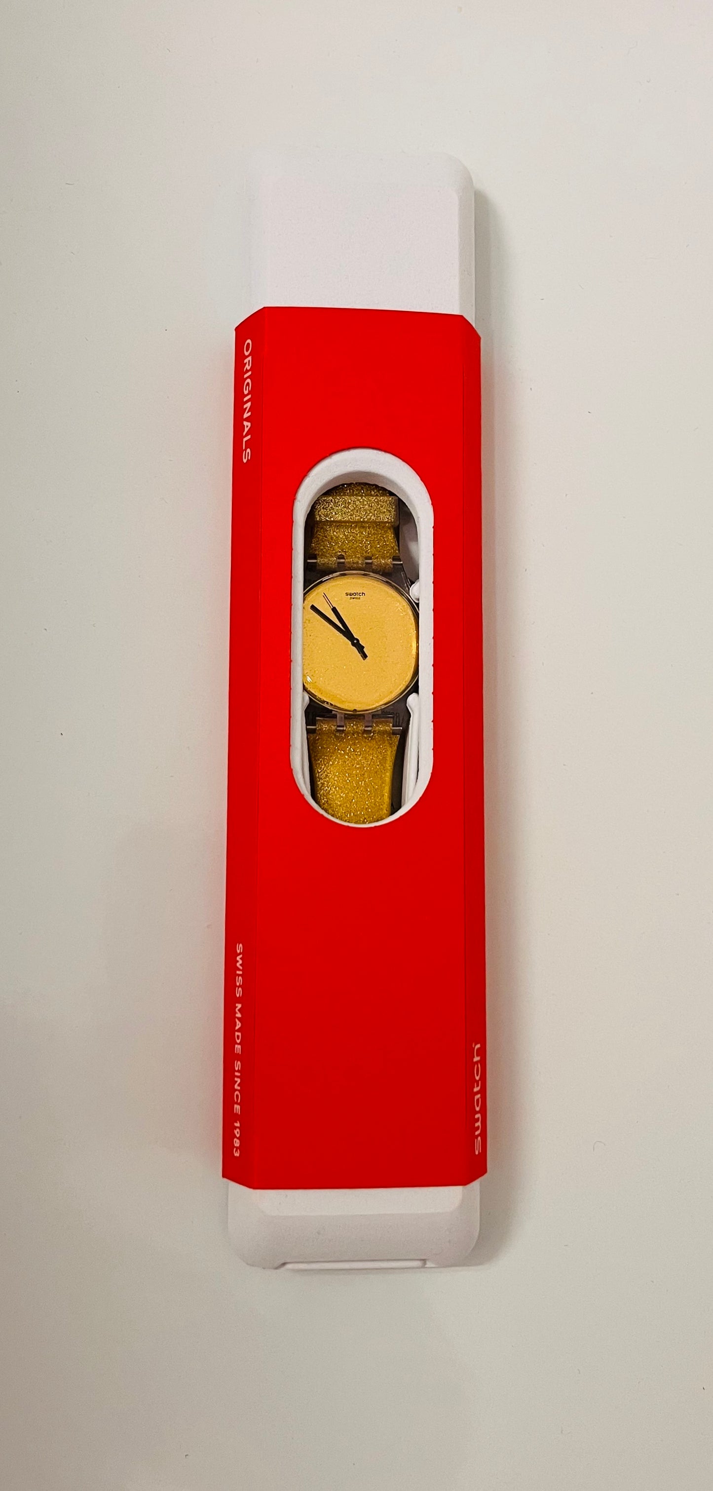 Montre doré Swatch